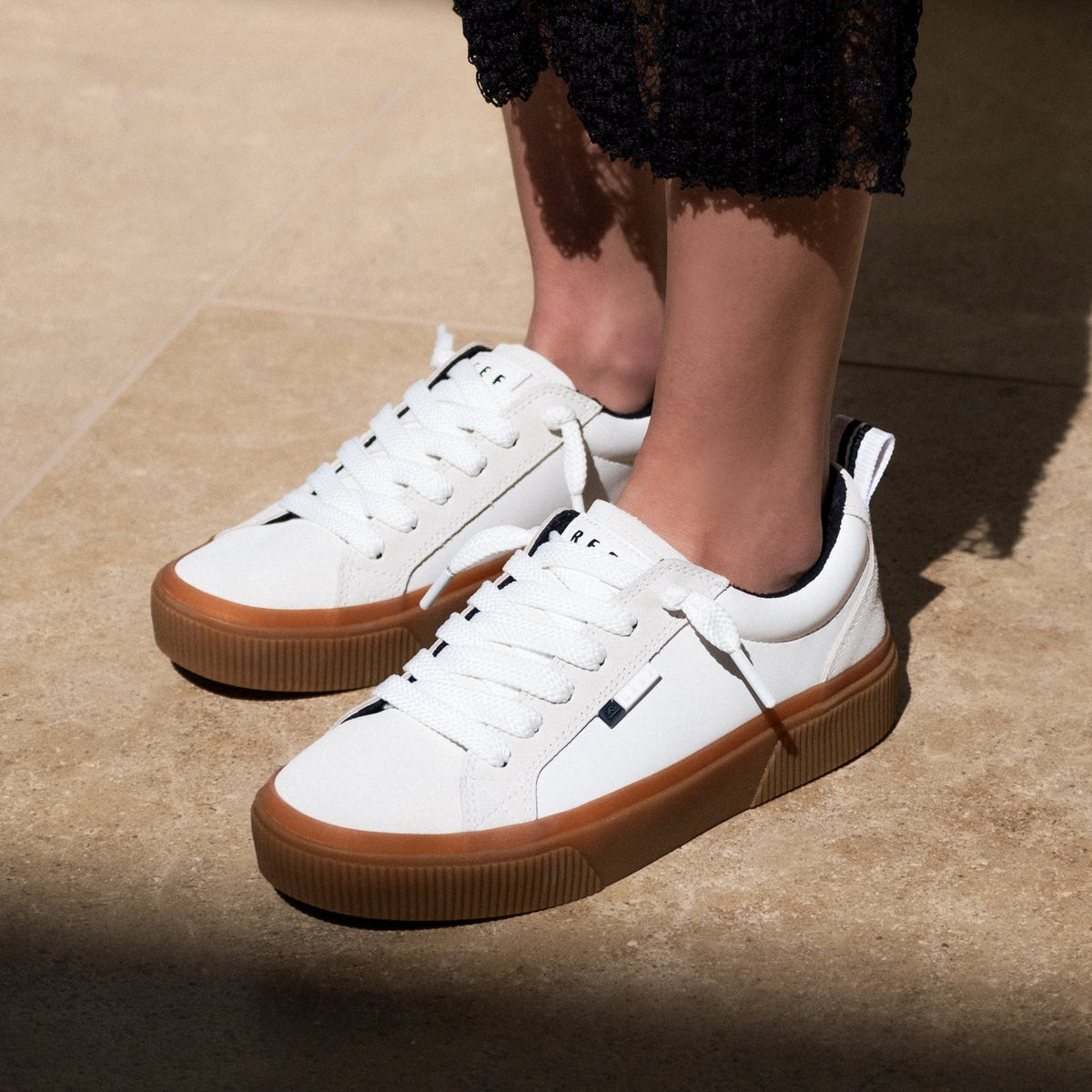 Lay Day Dawn women's white sneakers with gum sole, facing forward, featuring anatomical arch support and cushioning.