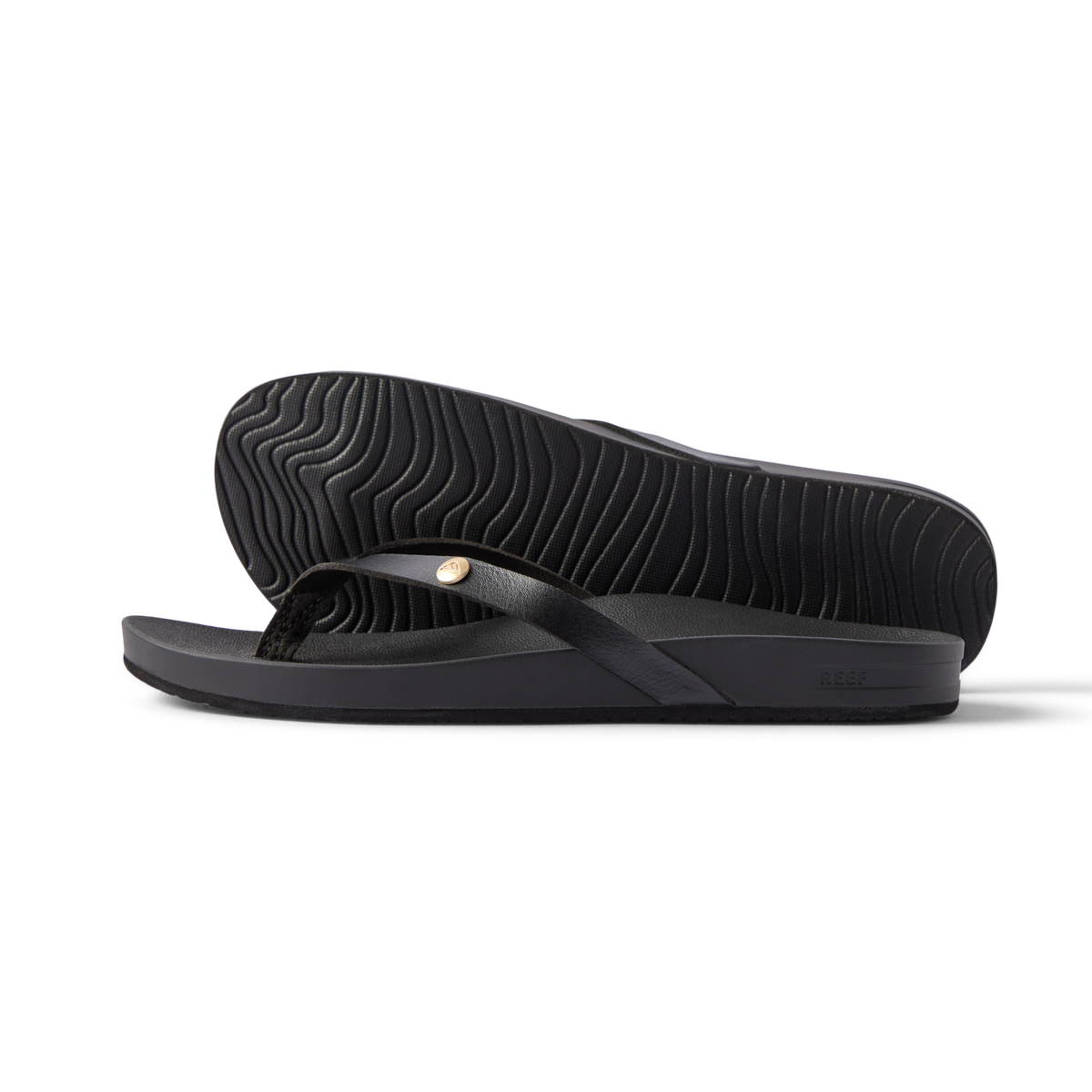 Vista Ivy women's black flip flop side view showing sole with textured pattern and soft cushioning for beach comfort