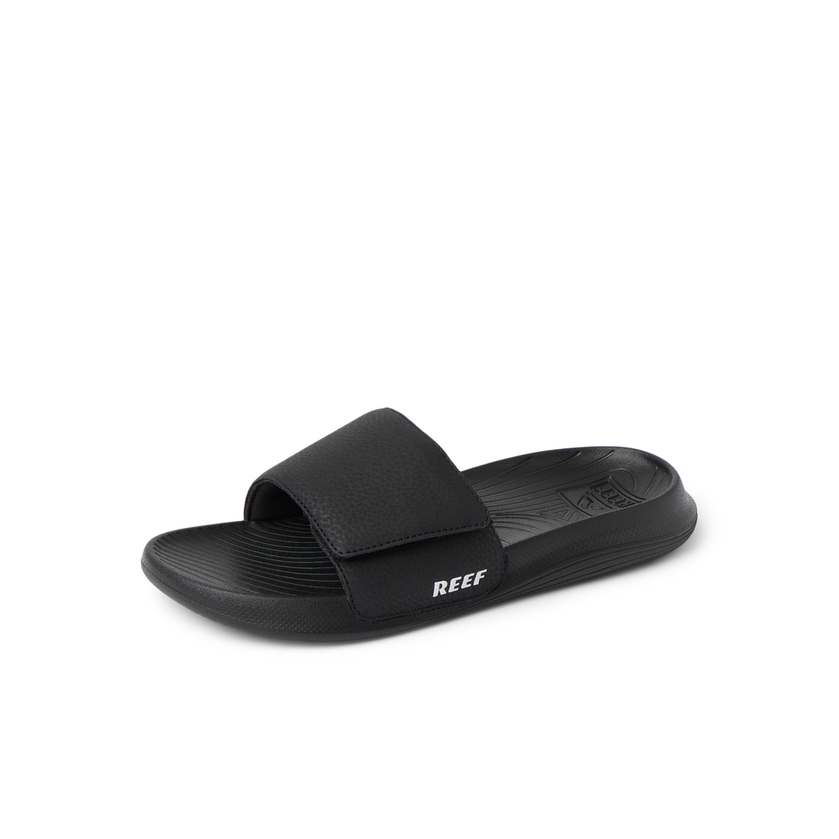 Kids Salty Slide in black facing left, close-up of the top and side showing cushioned footbed and adjustable strap.