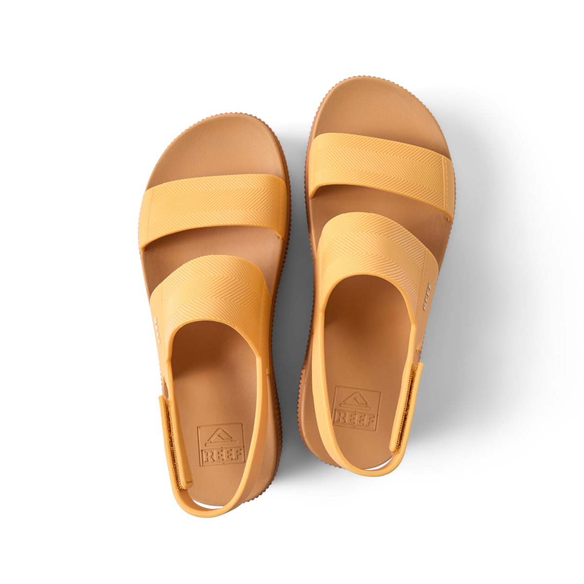 Top view of pair of Water Vista Higher sandals in golden apricot, designed for comfort with arch support and soft cushioning.