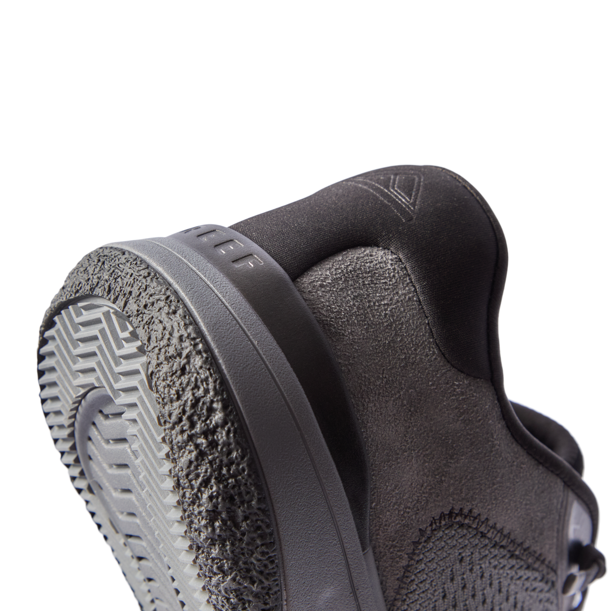 Close-up of the Shoreline Del Mar shoe heel facing left, featuring grey sustainable materials and REEF comfort technology.