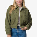Woman wearing olive green Sammie Sherpa Jacket front view with comfort-focused, surf-inspired design details.