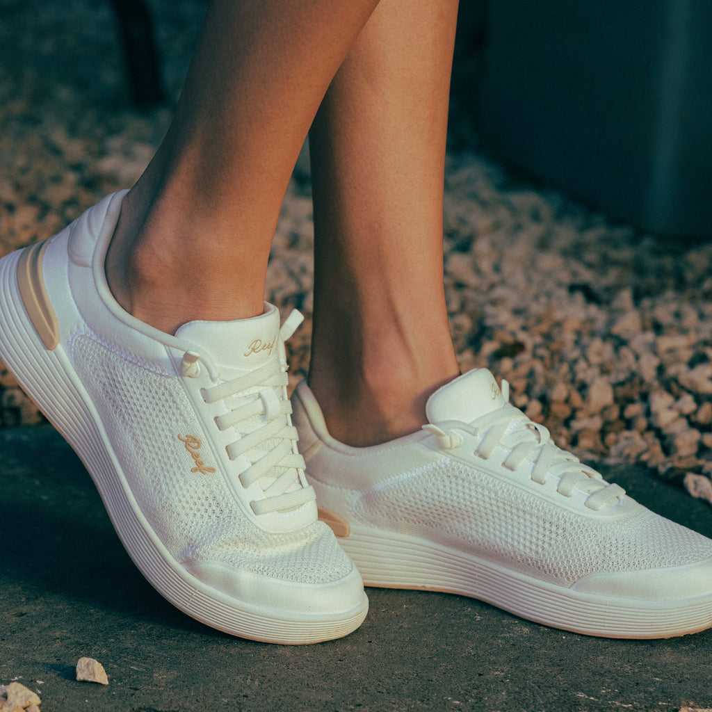 Shoreline Palisades women's white sneakers facing left, showing side and front with cushioned, breathable design.